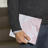 A business man holds Personalized VistaCase reMarkable Pen Holder Case with Pink Marble design